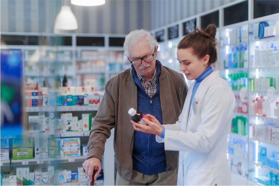 pharmacist-helping-senior-man-to-choos-medicine.jpg