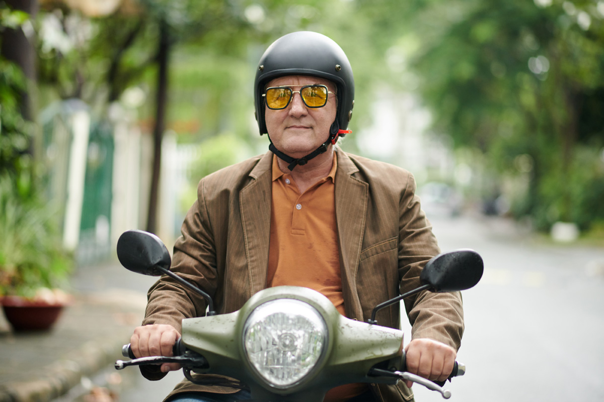 senior man riding on scooter in orlando