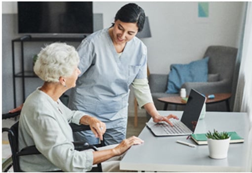 nurse helping senior woman