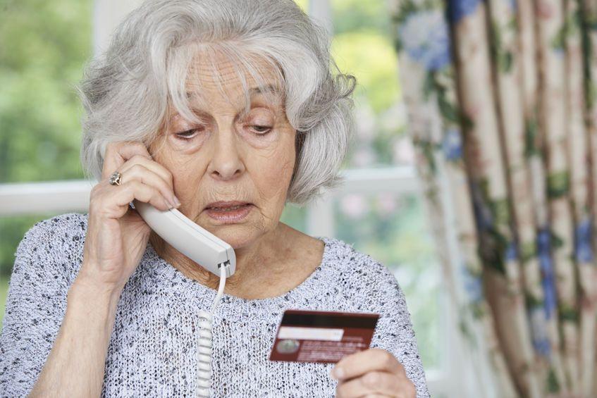 senior woman confused answering the phone