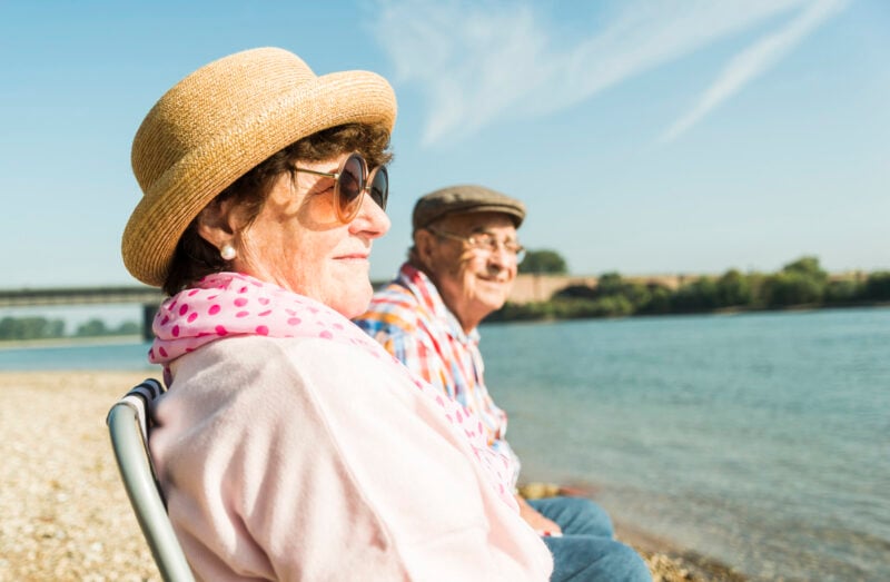 couple sitting on chairs savannah river