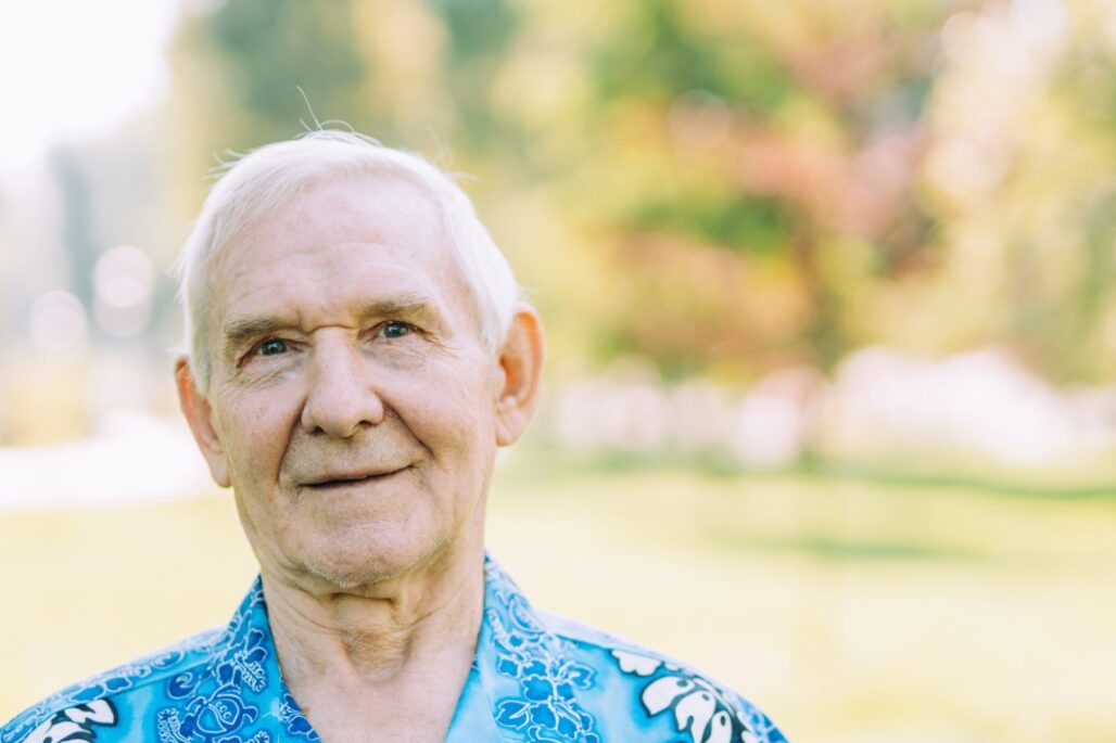 group of senior friends playing at the park