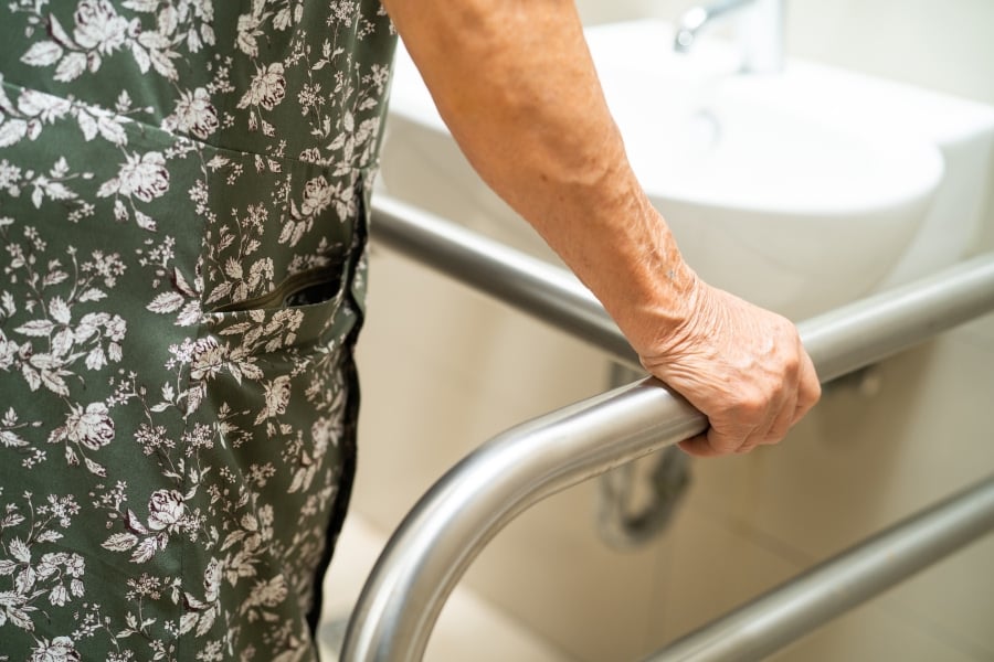senior using grab bars