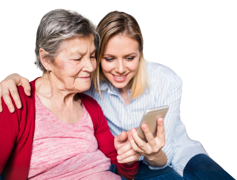 lady showing a phone to an elderly woman